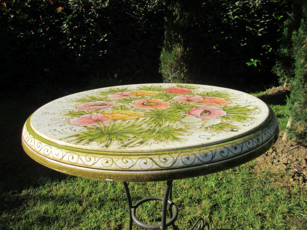 Tuscan round table with ceramic top and wrought iron base in anemone pattern